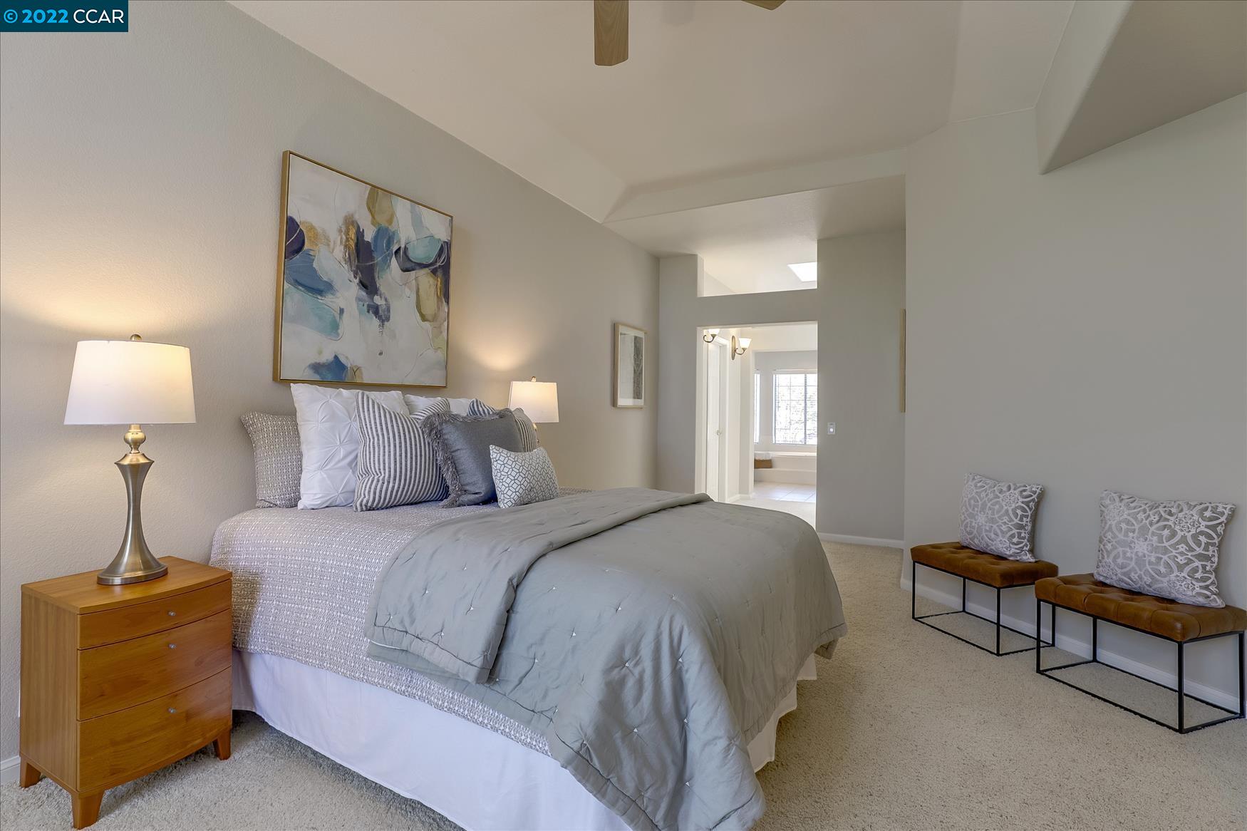 388 Catalan Way San Ramon, CA 94582 - Photo 26 of 52 a spacious bedroom with a bed and a lamp