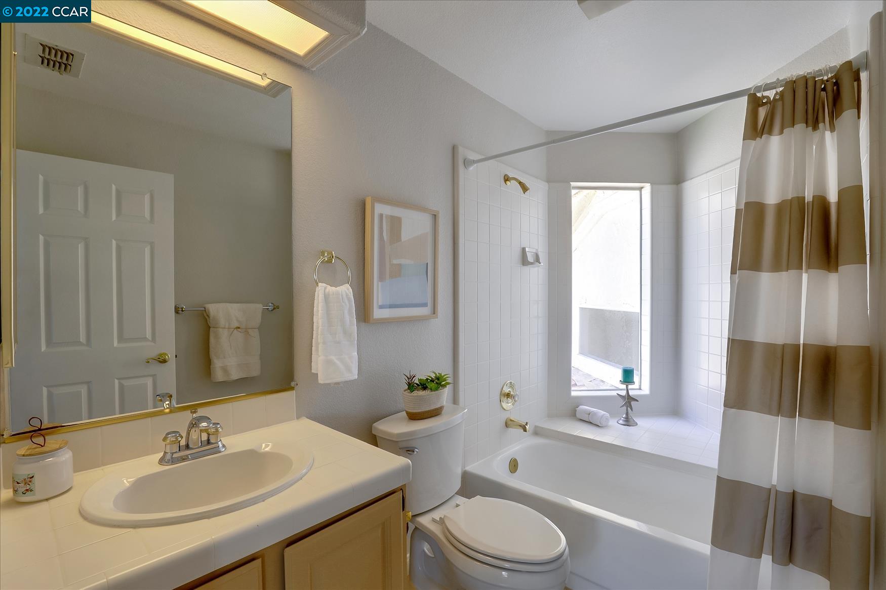 388 Catalan Way San Ramon, CA 94582 - Photo 34 of 52 a bathroom with a sink a toilet a tub and shower