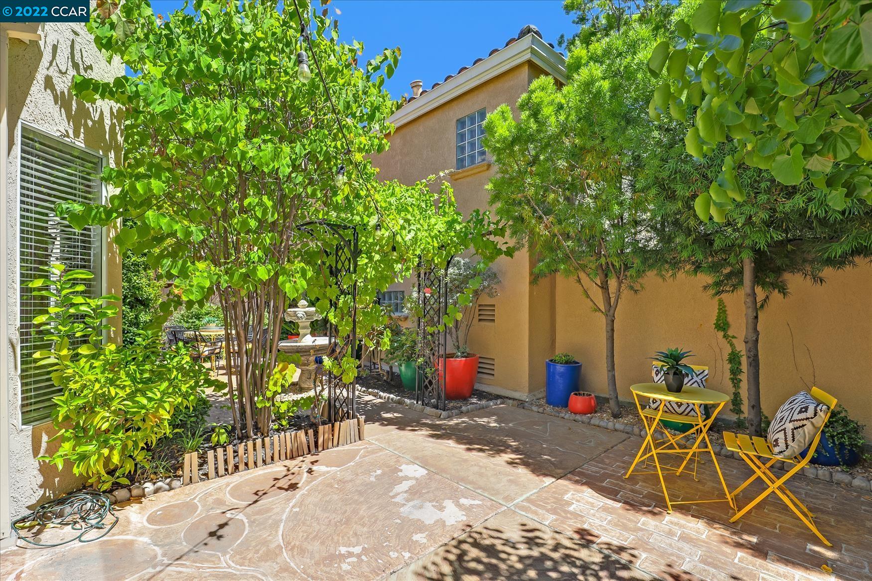 388 Catalan Way San Ramon, CA 94582 - Photo 47 of 52 a view of a backyard with table and chairs and potted plants