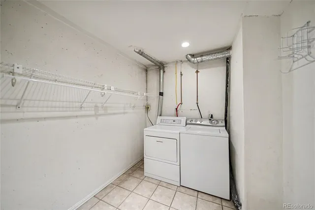 a view of storage and utility room with closet