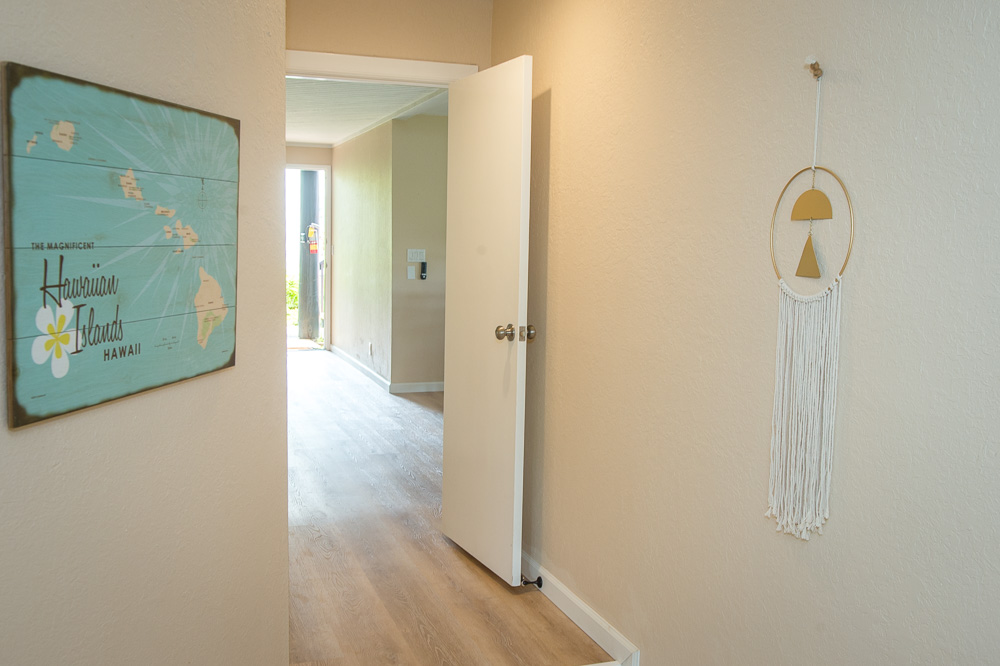 3920 Wyllie Road, Unit 9A Princeville, HI 96722 - Photo 23 of 30 a view of a hallway with wooden floor
