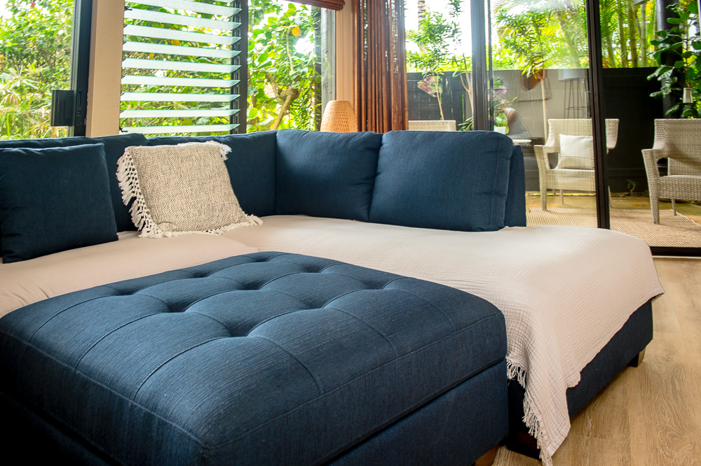 3920 Wyllie Road, Unit 9A Princeville, HI 96722 - Photo 4 of 30 a bedroom with a bed and a large window