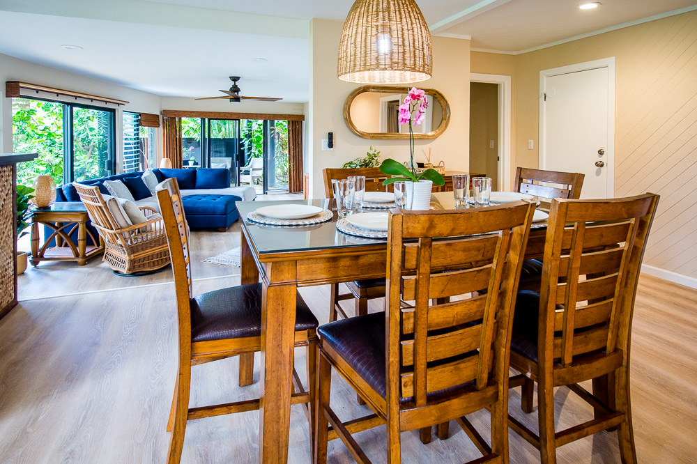 3920 Wyllie Road, Unit 9A Princeville, HI 96722 - Photo 6 of 30 a view of a dining area with furniture and a large window
