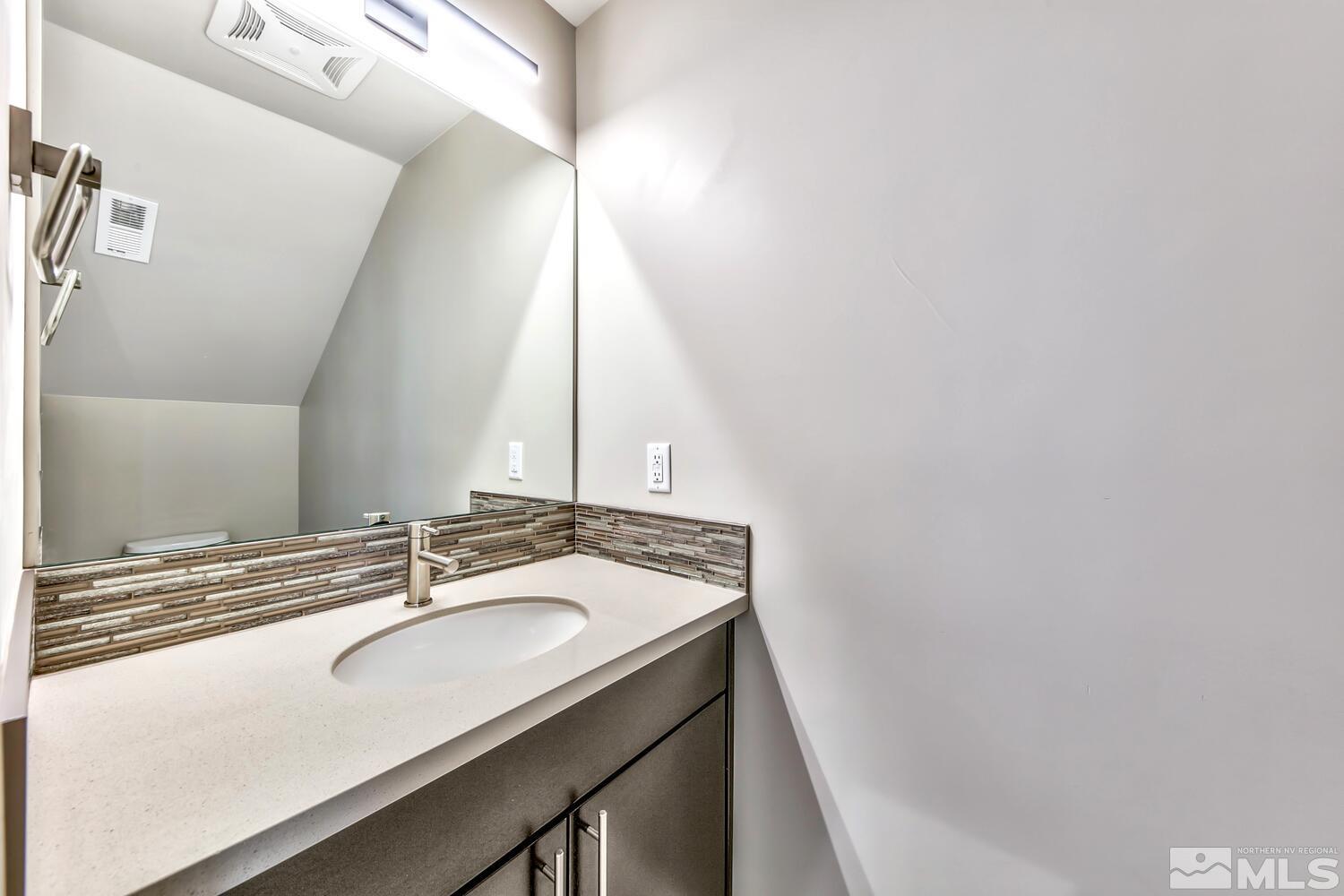 106 High Street Reno, NV 89502 - Photo 14 of 21 a bathroom with a sink and a mirror