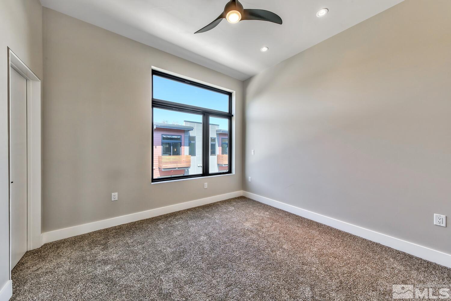 106 High Street Reno, NV 89502 - Photo 15 of 21 an empty room with windows and fan