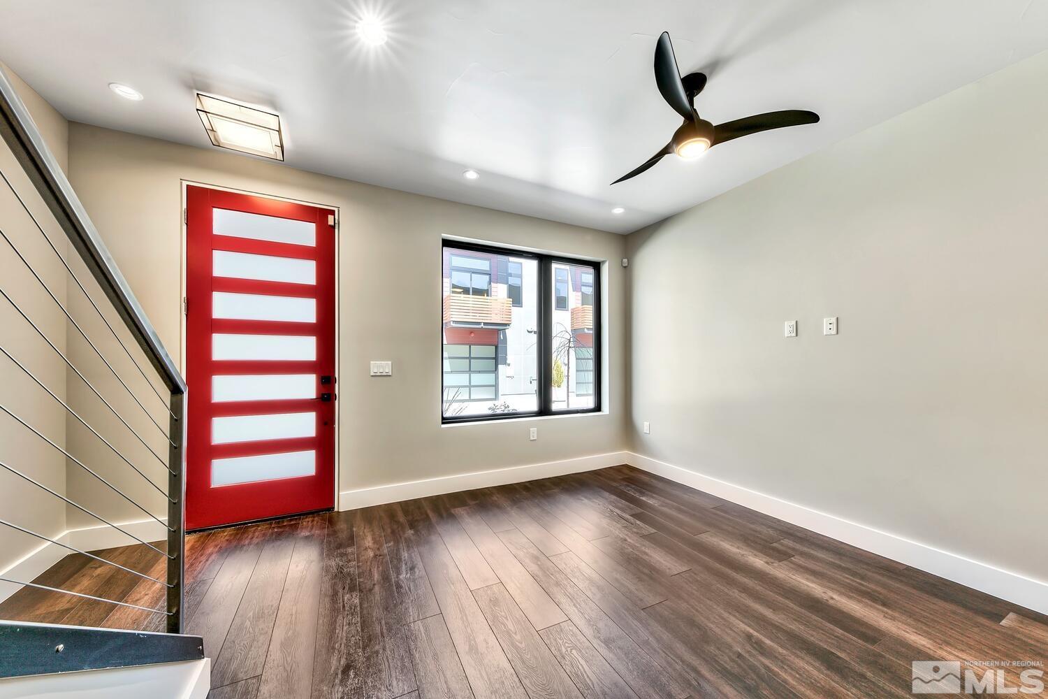 106 High Street Reno, NV 89502 - Photo 6 of 21 a view of an empty room with wooden floor and window