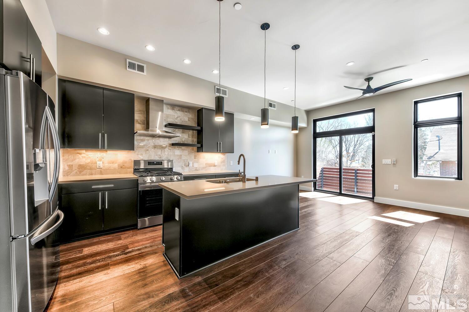 106 High Street Reno, NV 89502 - Photo 8 of 21 a kitchen with stainless steel appliances granite countertop a refrigerator a sink dishwasher a stove and a refrigerator