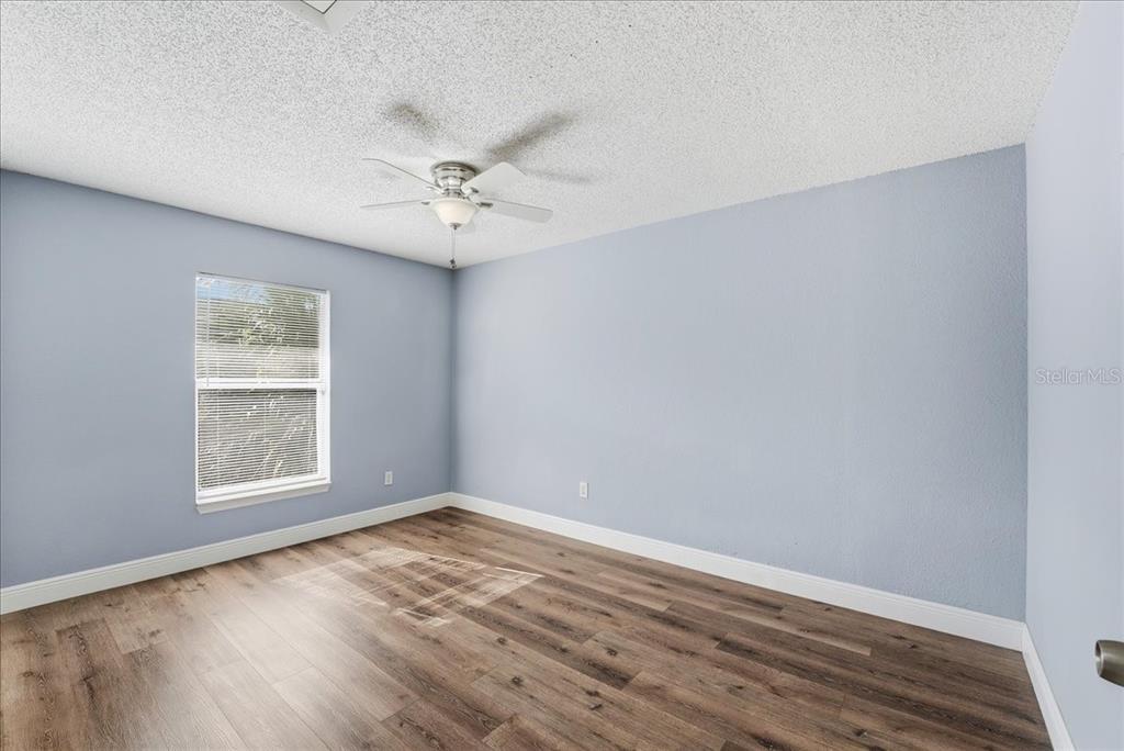 3651 North Goldenrod Road, Unit C204 Winter Park, FL 32792 - Photo 11 of 14 wooden floor in an empty room with a window