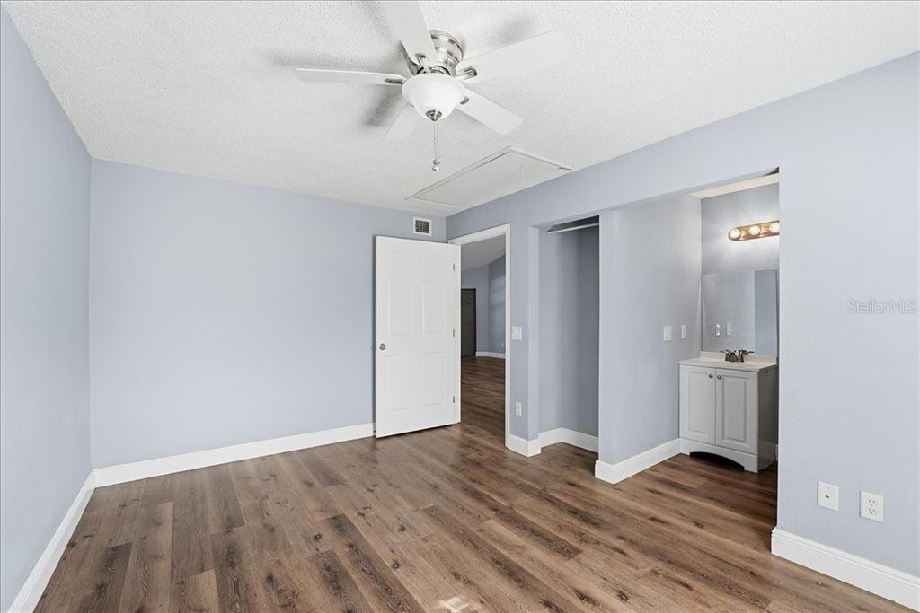 3651 North Goldenrod Road, Unit C204 Winter Park, FL 32792 - Photo 12 of 14 a view of an empty room with wooden floor