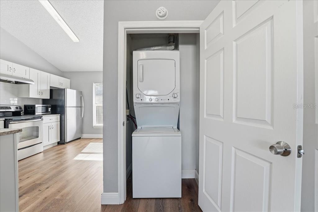 3651 North Goldenrod Road, Unit C204 Winter Park, FL 32792 - Photo 7 of 14 a view of a kitchen from the hallway