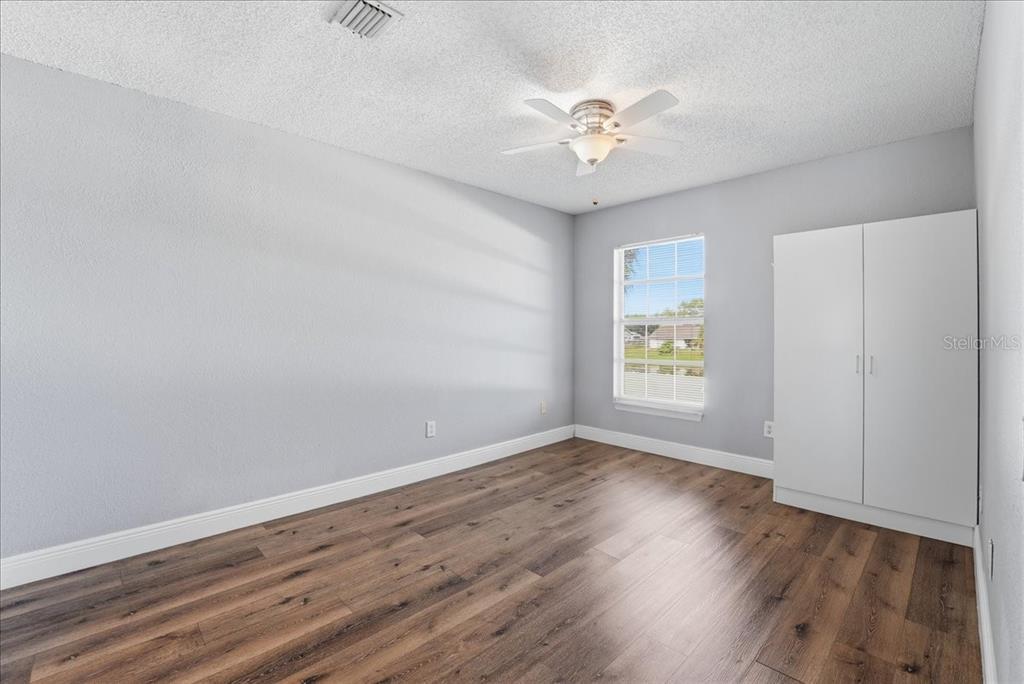 3651 North Goldenrod Road, Unit C204 Winter Park, FL 32792 - Photo 8 of 14 a view of an empty room with wooden floor and a window