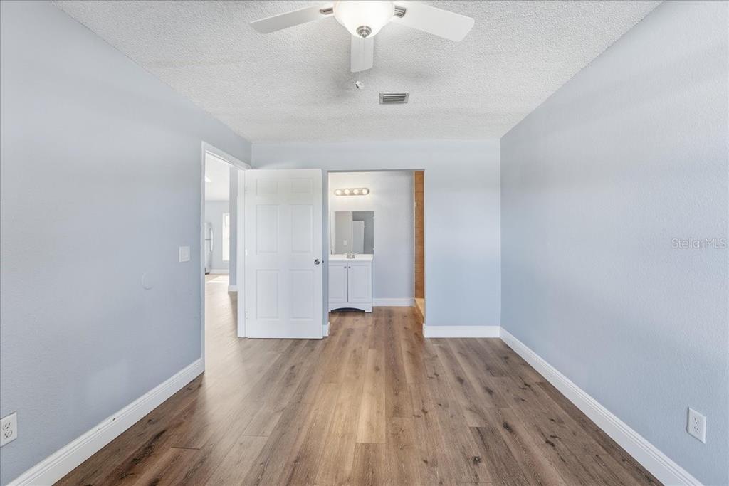 3651 North Goldenrod Road, Unit C204 Winter Park, FL 32792 - Photo 9 of 14 a view of a room with wooden floor and a window