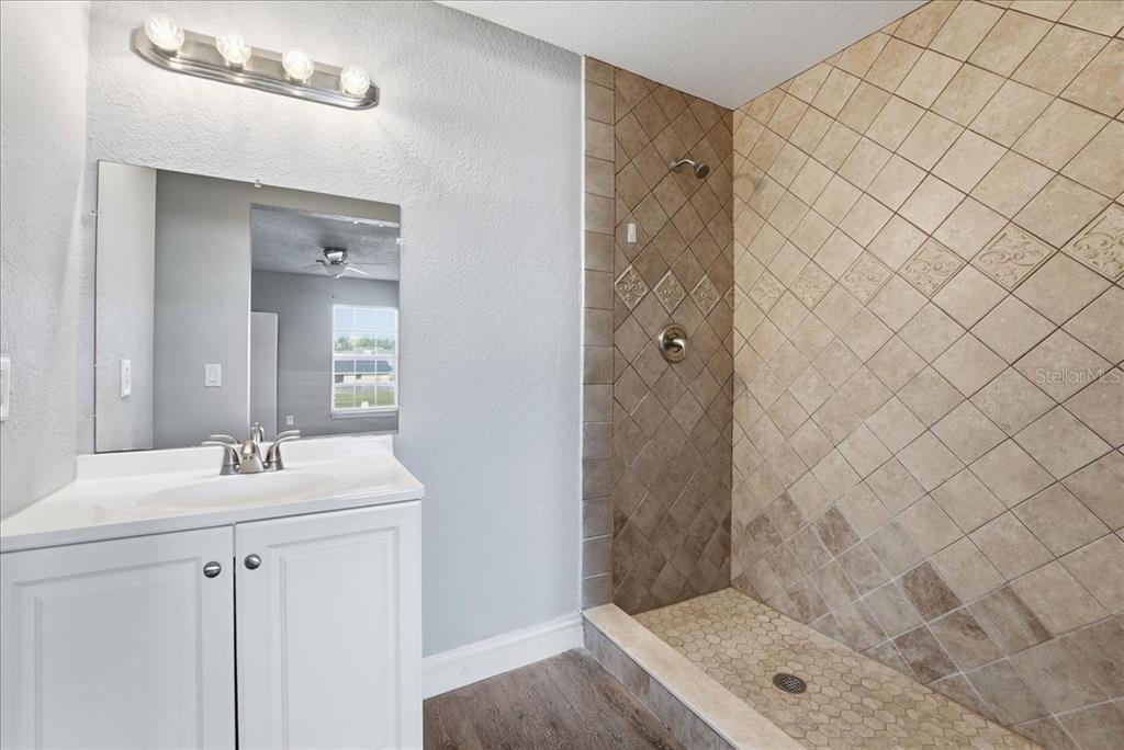 3651 North Goldenrod Road, Unit C204 Winter Park, FL 32792 - Photo 10 of 14 a bathroom with a sink and a mirror