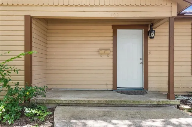 a view of a house with a door and a window