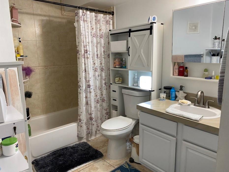 801 Lyons Road, Unit 19108 Coconut Creek, FL 33063 - Photo 11 of 42 a bathroom with a sink toilet and shower