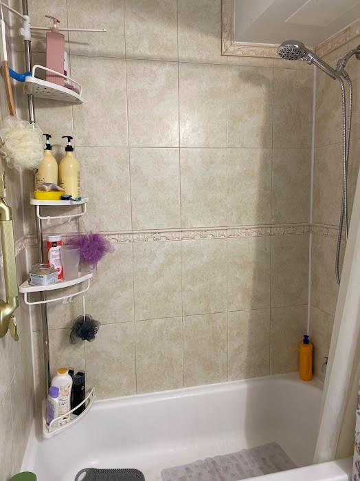 801 Lyons Road, Unit 19108 Coconut Creek, FL 33063 - Photo 12 of 42 a bathroom with a bathtub