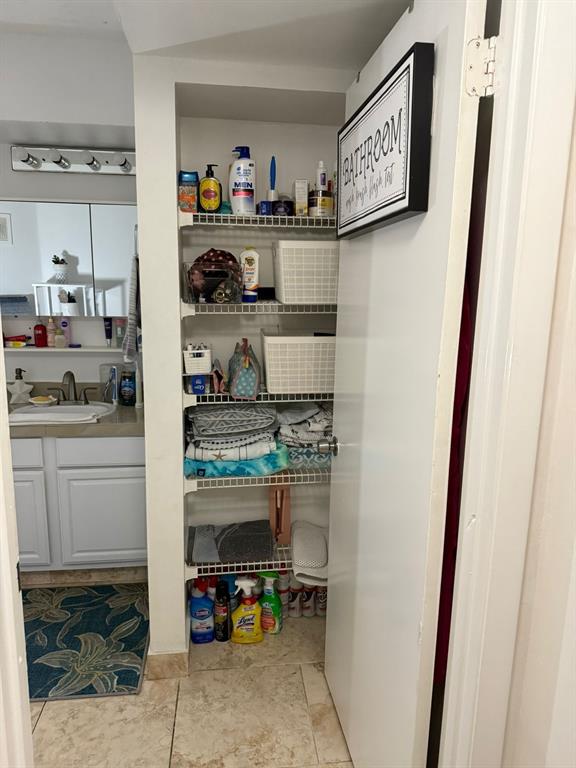 801 Lyons Road, Unit 19108 Coconut Creek, FL 33063 - Photo 13 of 42 a kitchen with stainless steel appliances a refrigerator and cabinets