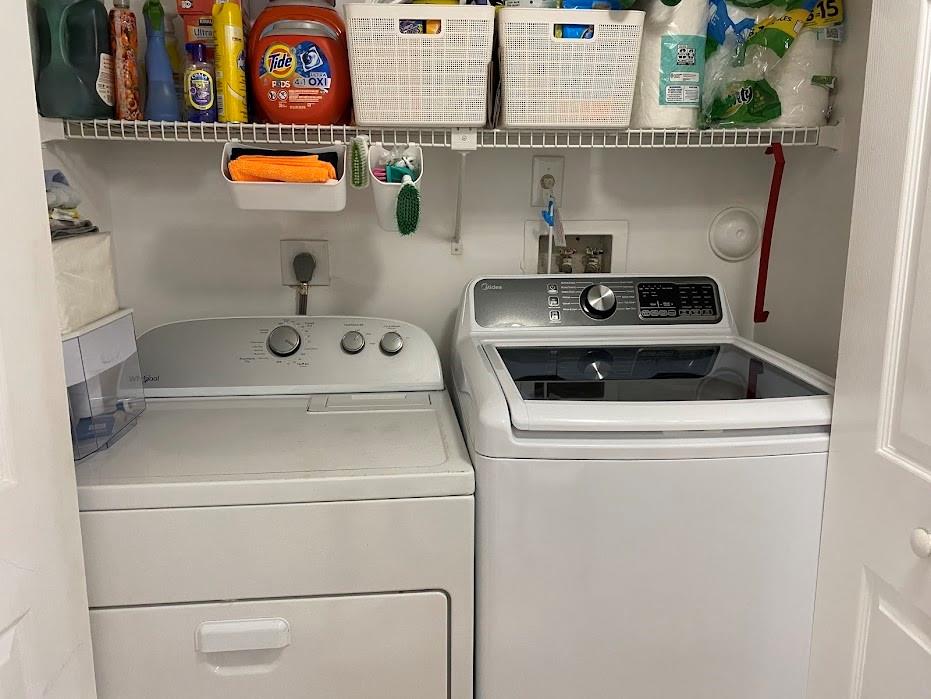801 Lyons Road, Unit 19108 Coconut Creek, FL 33063 - Photo 16 of 42 a utility room with dryer and washer