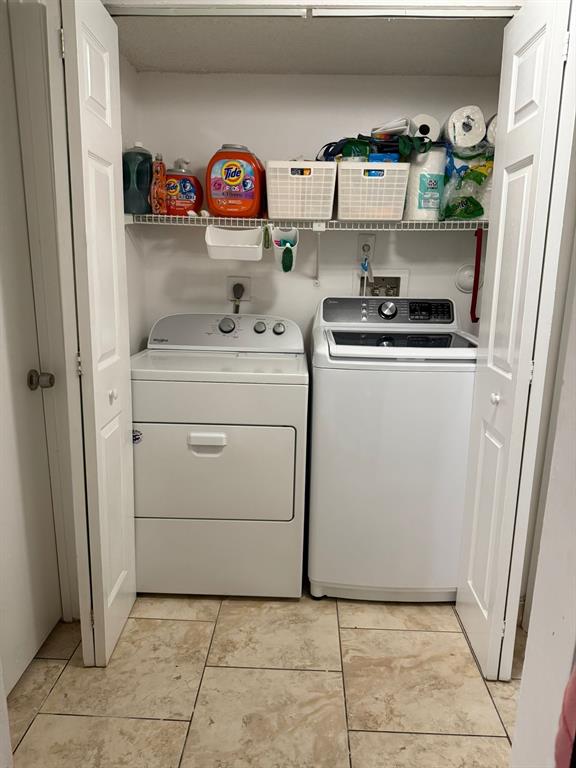 801 Lyons Road, Unit 19108 Coconut Creek, FL 33063 - Photo 17 of 42 a kitchen with a refrigerator and a stove