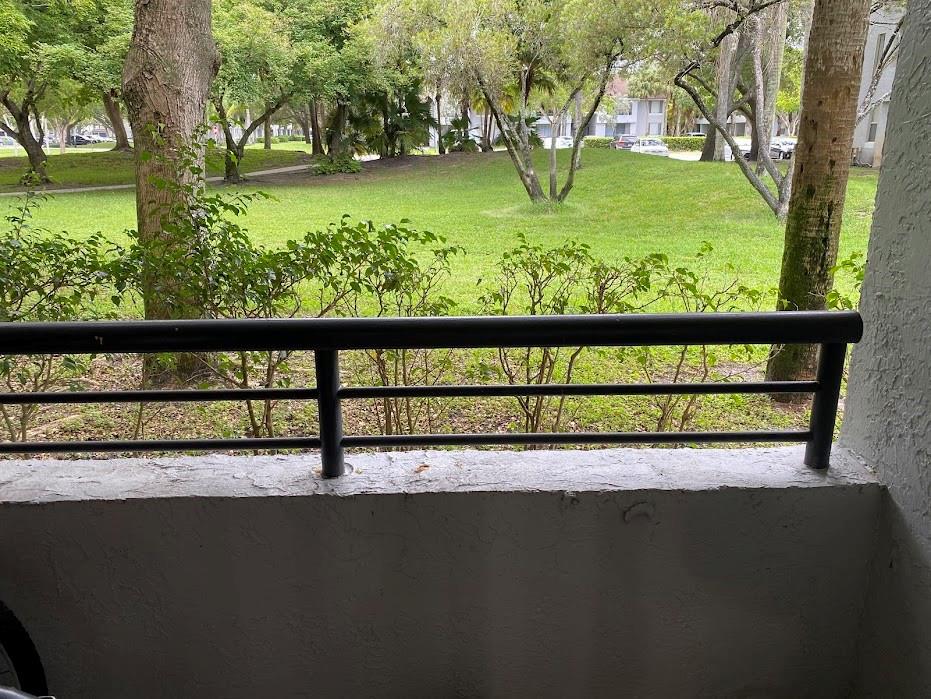 801 Lyons Road, Unit 19108 Coconut Creek, FL 33063 - Photo 21 of 42 a view of swimming pool from a yard