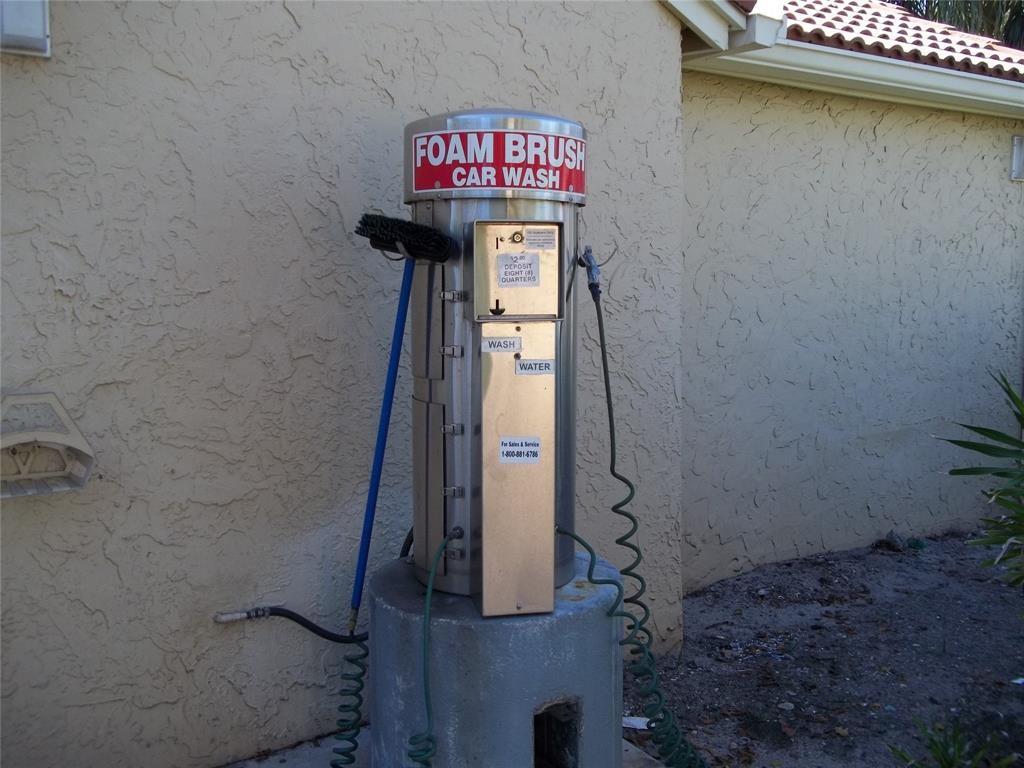 801 Lyons Road, Unit 19108 Coconut Creek, FL 33063 - Photo 24 of 42 a sign that is on the side of a building