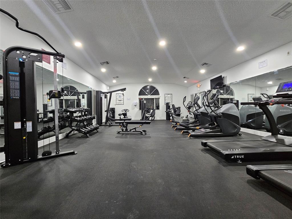 801 Lyons Road, Unit 19108 Coconut Creek, FL 33063 - Photo 25 of 42 a view of a room with gym equipment