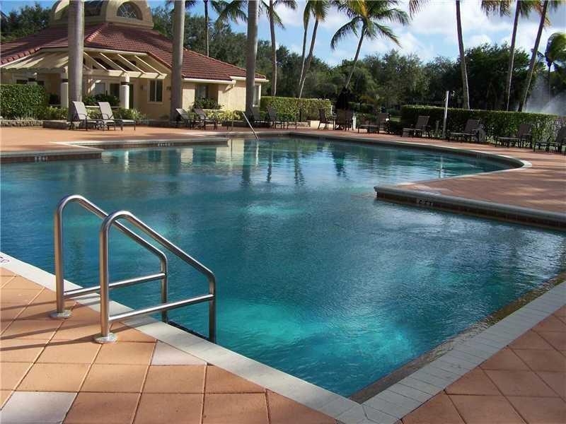 801 Lyons Road, Unit 19108 Coconut Creek, FL 33063 - Photo 4 of 42 a view of swimming pool with chairs