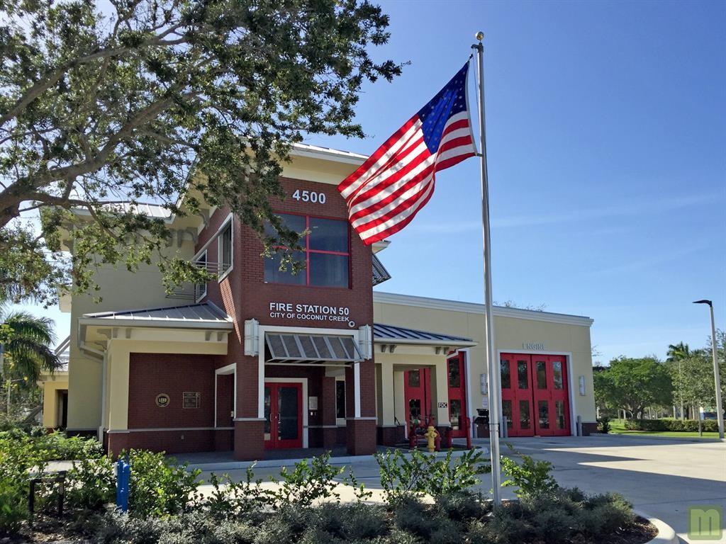 801 Lyons Road, Unit 19108 Coconut Creek, FL 33063 - Photo 41 of 42 a painting on the wall of a building