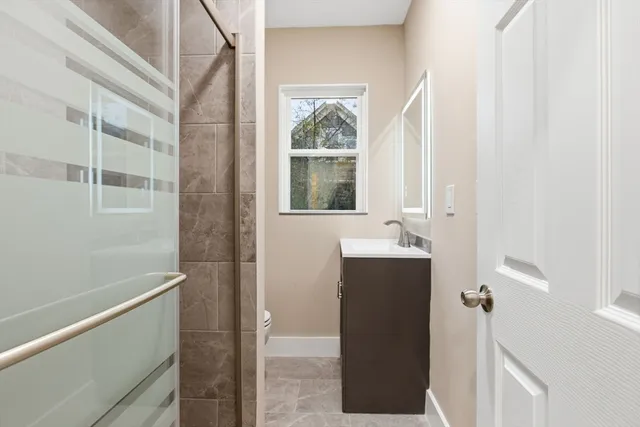 a bathroom with a bathtub and shower