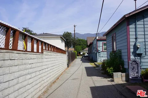 a view of a house with a small yard