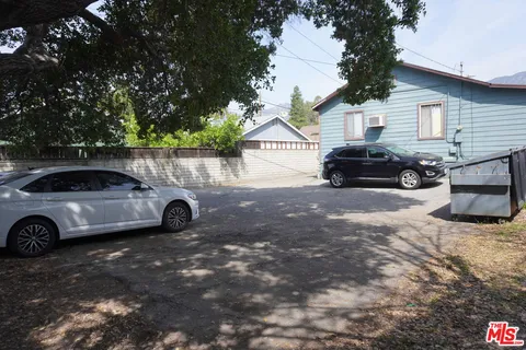 a view of a car in front of a house