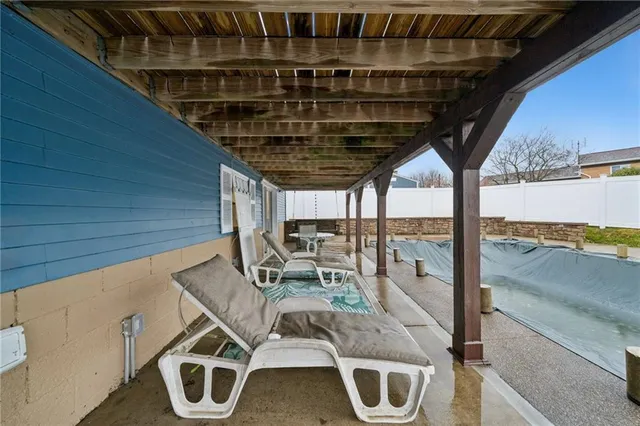 a patio with table and chairs