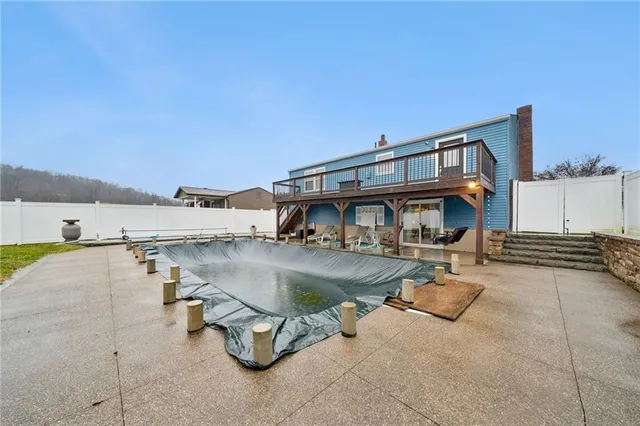 a view of a swimming pool with lounge chairs