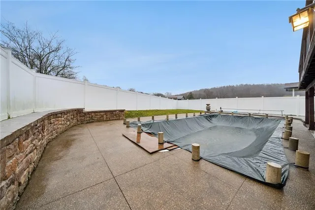 a view of a swimming pool with a lounge chair