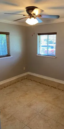 a view of an empty room with a window