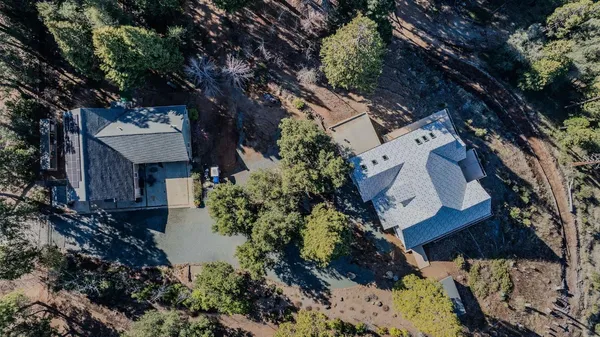 a view of a house with a tree