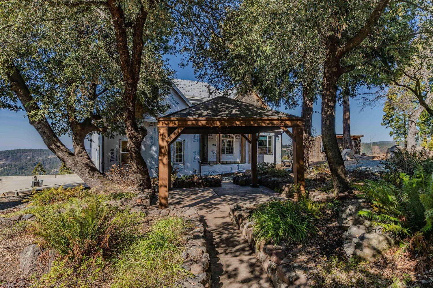 24985 Shake Ridge Road Volcano, CA 95689 - Photo 32 of 92 a front view of a house with a yard