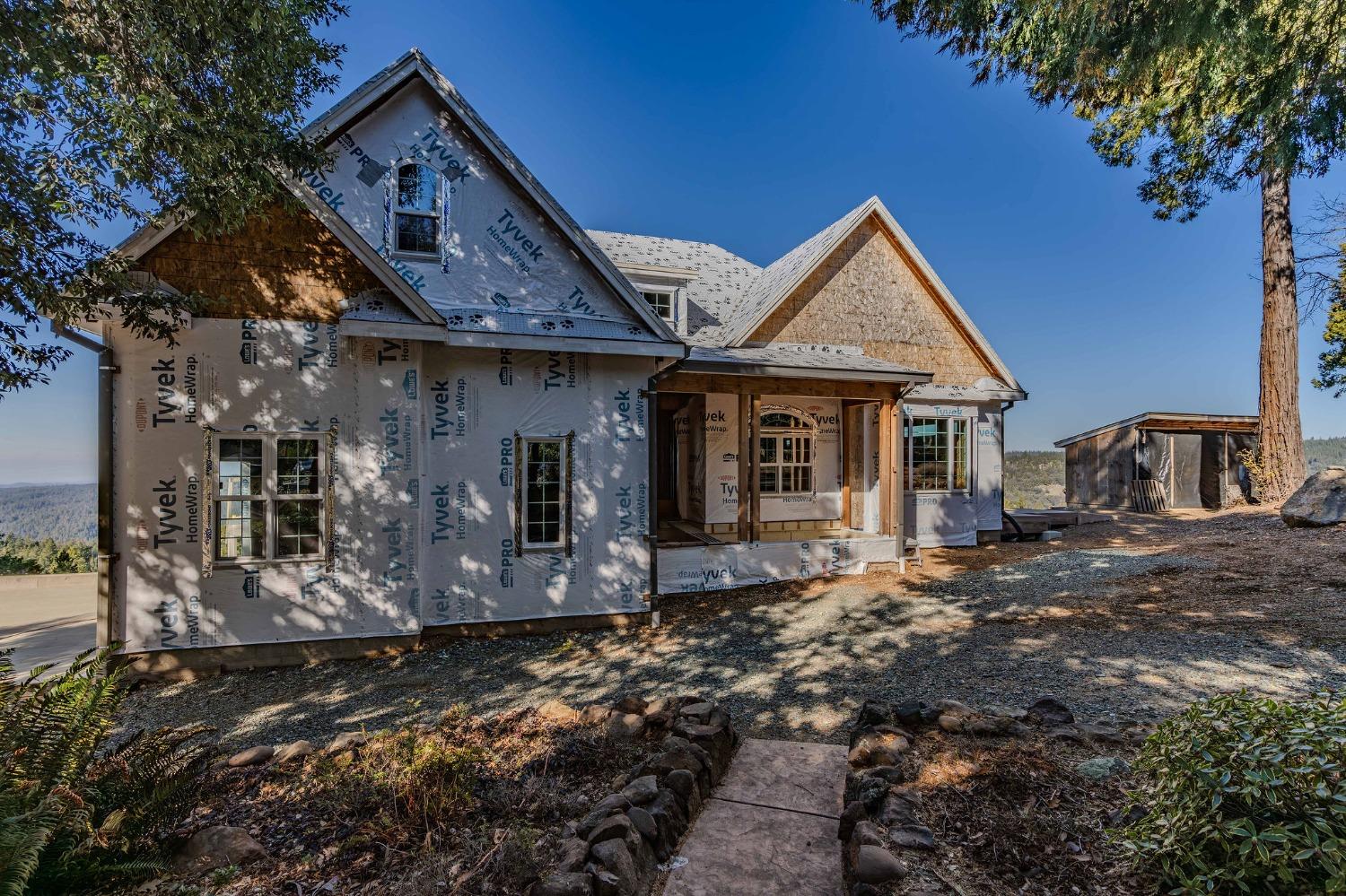 24985 Shake Ridge Road Volcano, CA 95689 - Photo 45 of 92 a front view of a house with parking space