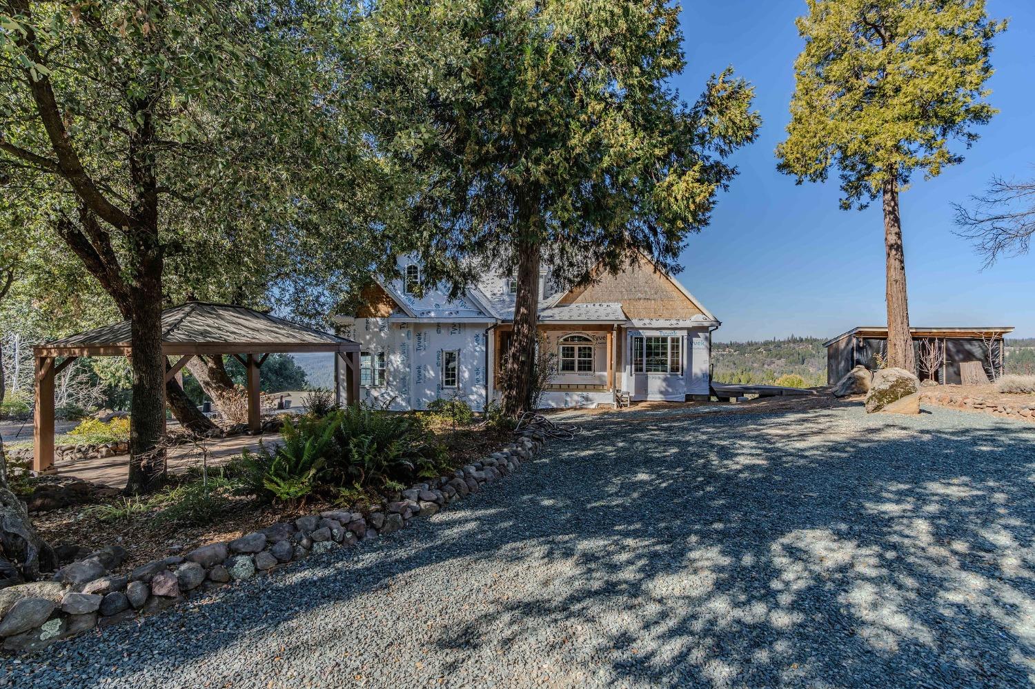 24985 Shake Ridge Road Volcano, CA 95689 - Photo 71 of 92 a front view of a house with garden