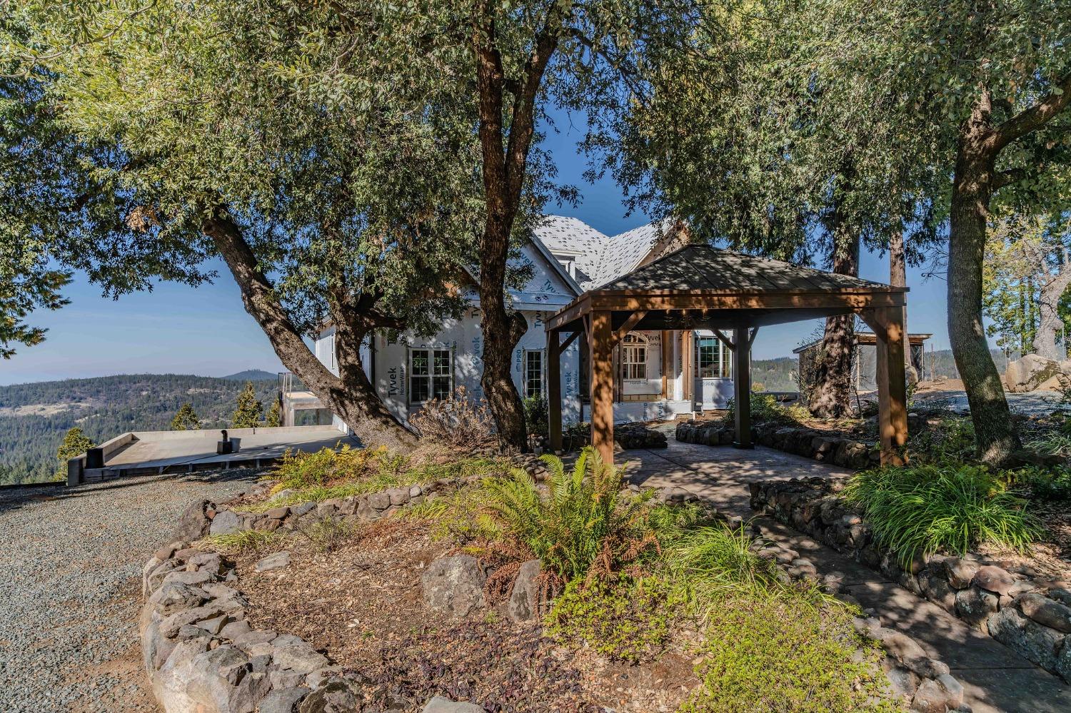 24985 Shake Ridge Road Volcano, CA 95689 - Photo 72 of 92 a front view of a house with a yard