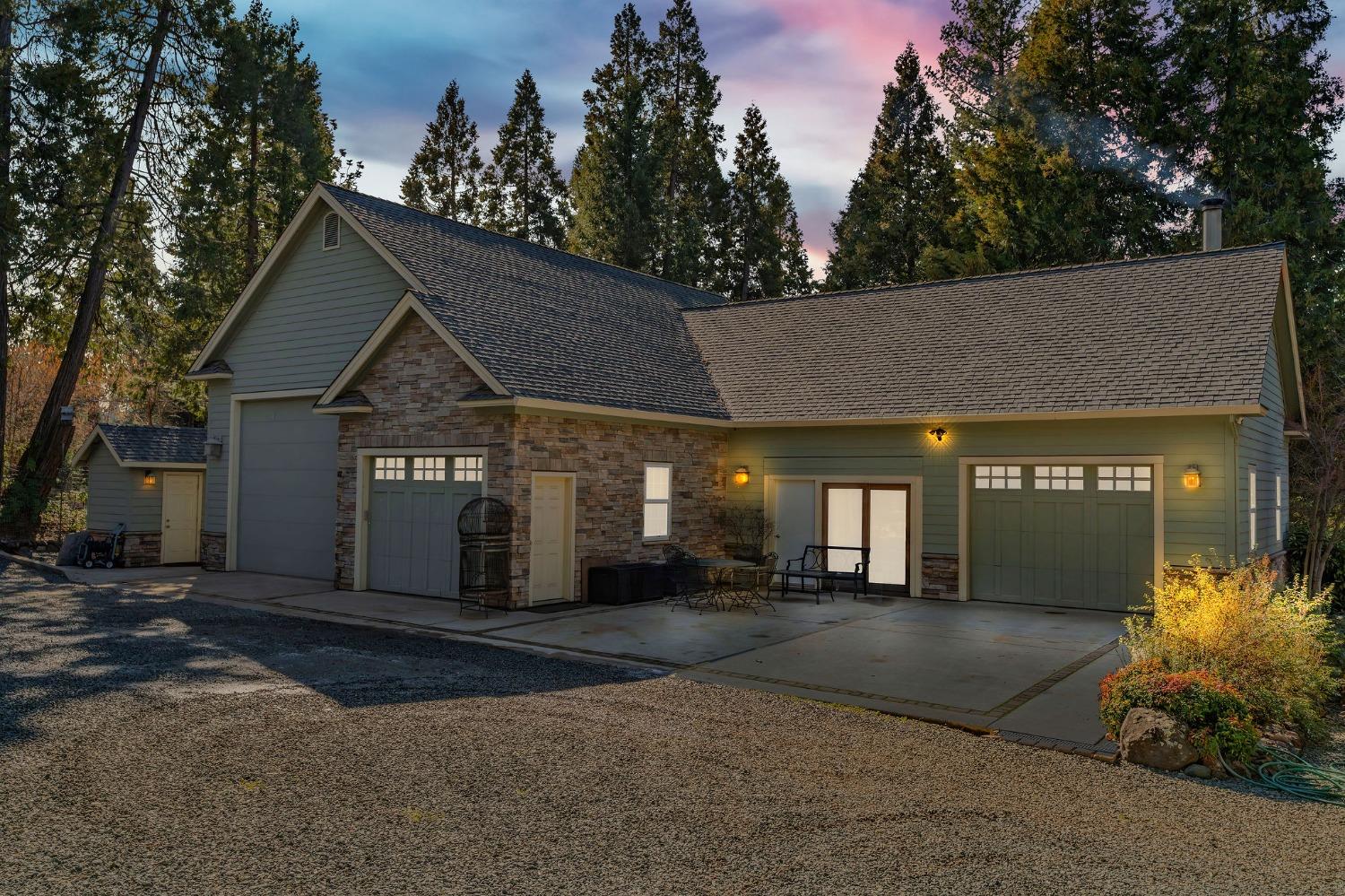 24985 Shake Ridge Road Volcano, CA 95689 - Photo 85 of 92 a front view of a house with a yard and garage