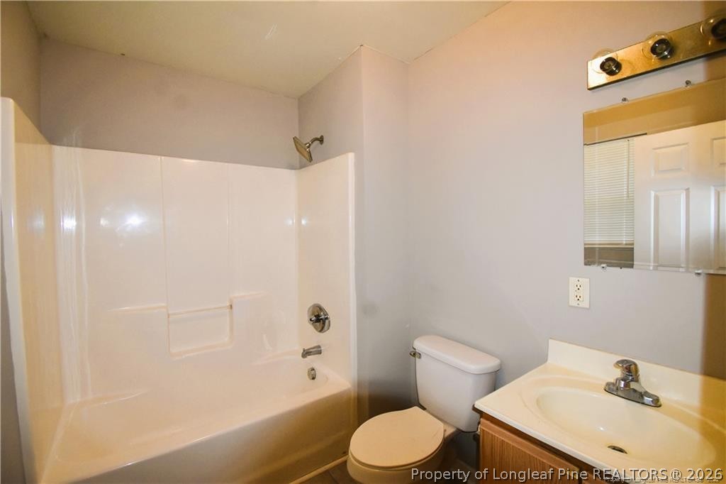 6158 Lonestar Road Fayetteville, NC 28303 - Photo 14 of 20 a bathroom with a sink and a mirror
