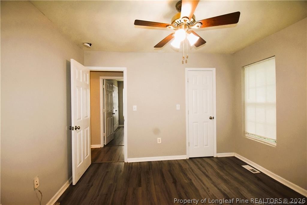 6158 Lonestar Road Fayetteville, NC 28303 - Photo 19 of 20 wooden floor in an empty room with a window