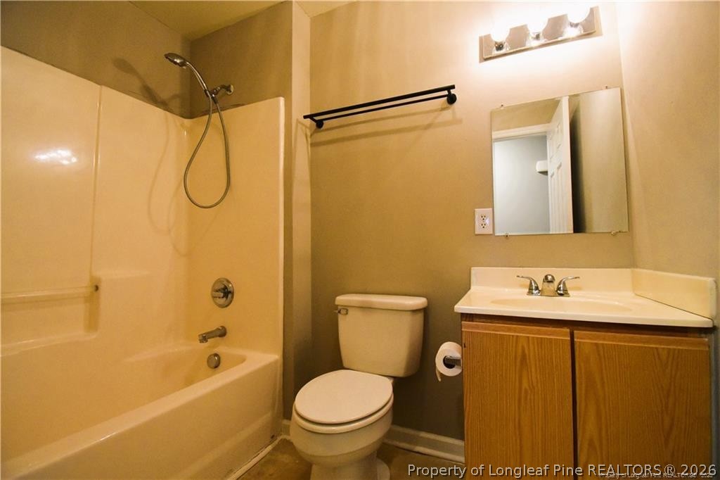 6158 Lonestar Road Fayetteville, NC 28303 - Photo 20 of 20 a bathroom with a sink toilet and shower