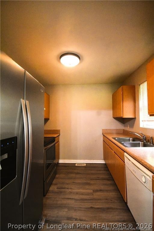 6158 Lonestar Road Fayetteville, NC 28303 - Photo 6 of 20 a kitchen with stainless steel appliances granite countertop a refrigerator a stove and a sink