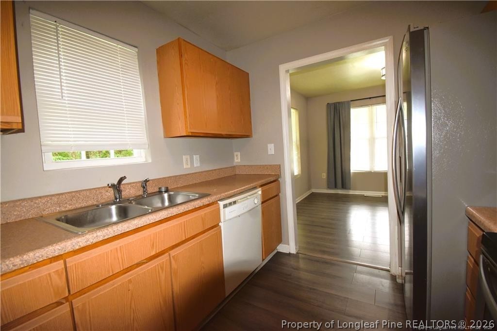 6158 Lonestar Road Fayetteville, NC 28303 - Photo 8 of 20 a kitchen with stainless steel appliances granite countertop a sink and a stove