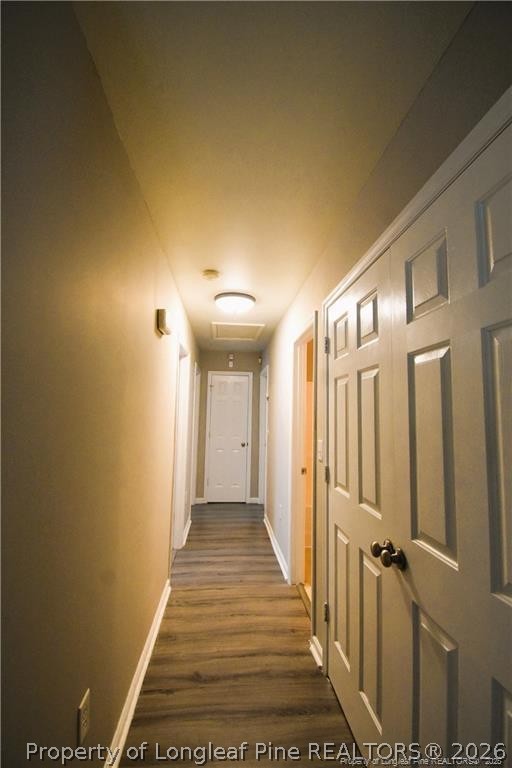 6158 Lonestar Road Fayetteville, NC 28303 - Photo 10 of 20 a view of a hallway with wooden floor and staircase