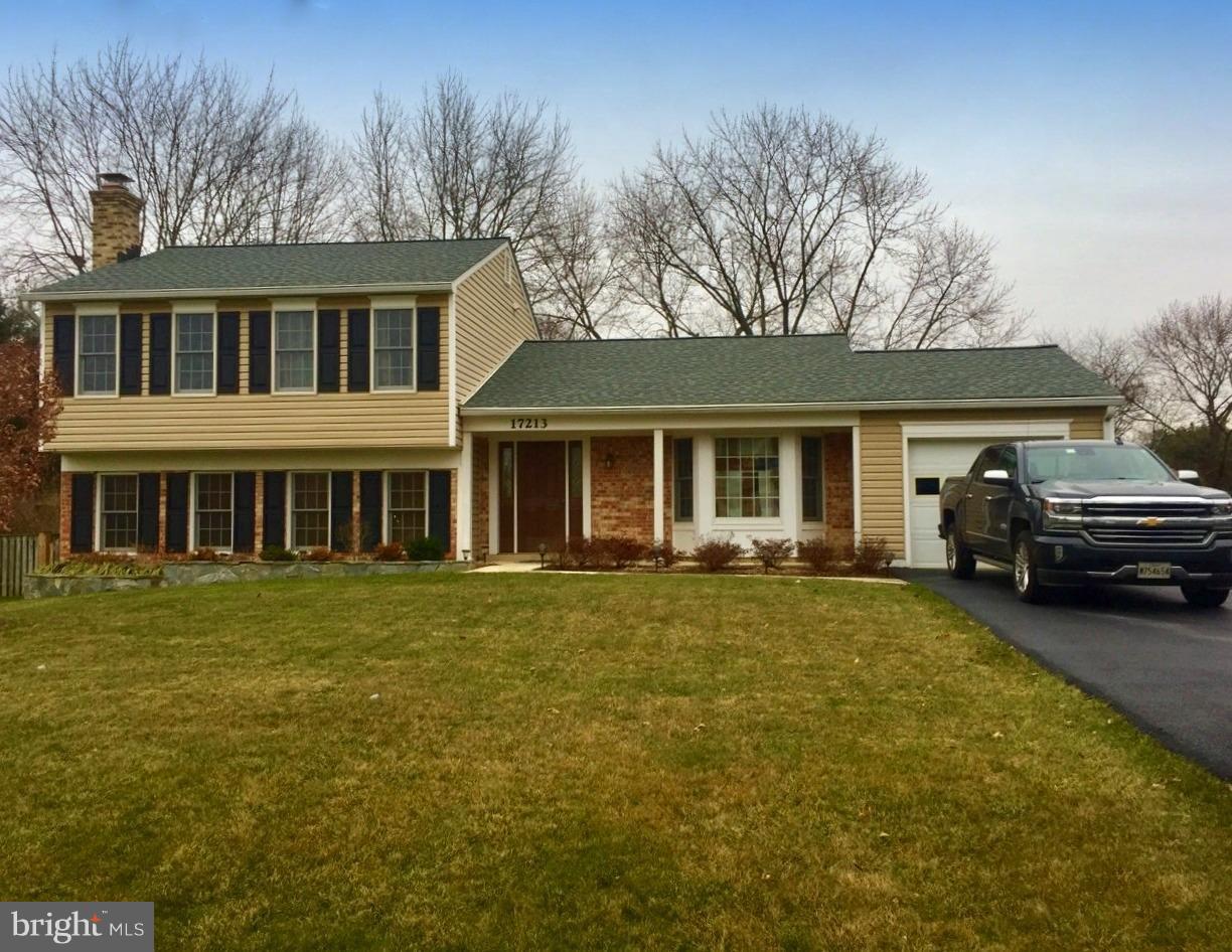 17213 Hoskinson Road Poolesville, MD 20837 - Photo 2 of 2 a front view of a house with a garden