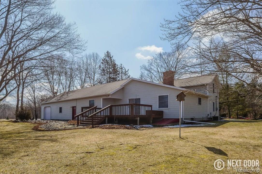 10500 West Allen Road Fowlerville, MI 48836 - Photo 27 of 42 10500 back view huge deck.jpg
