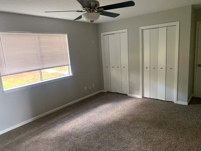 a view of an empty room with a window